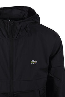 Side picture of a Lightweight water proof jacket, Features the iconic Lacoste logo.