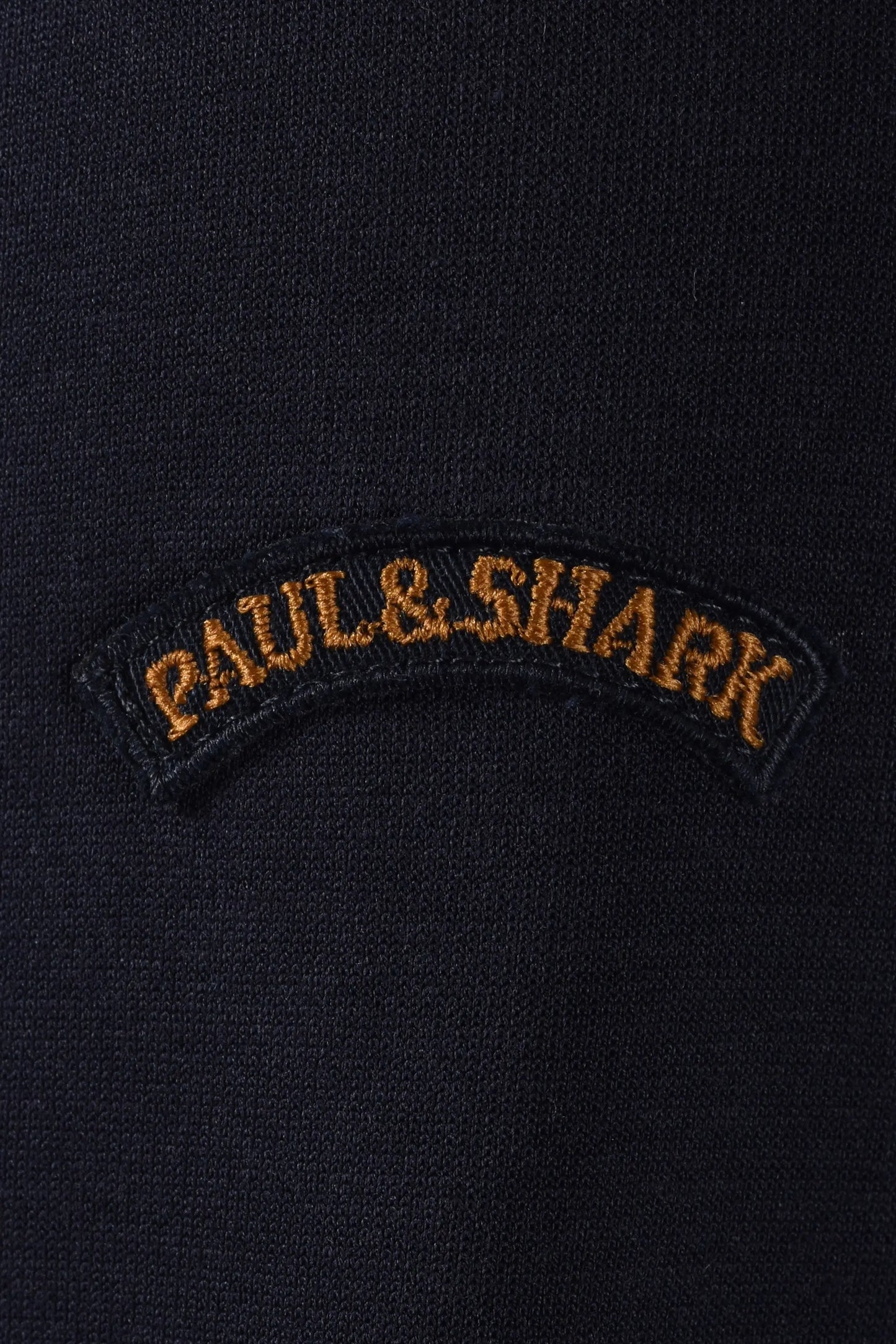 Paul & Shark logo on a dark jacket close up 