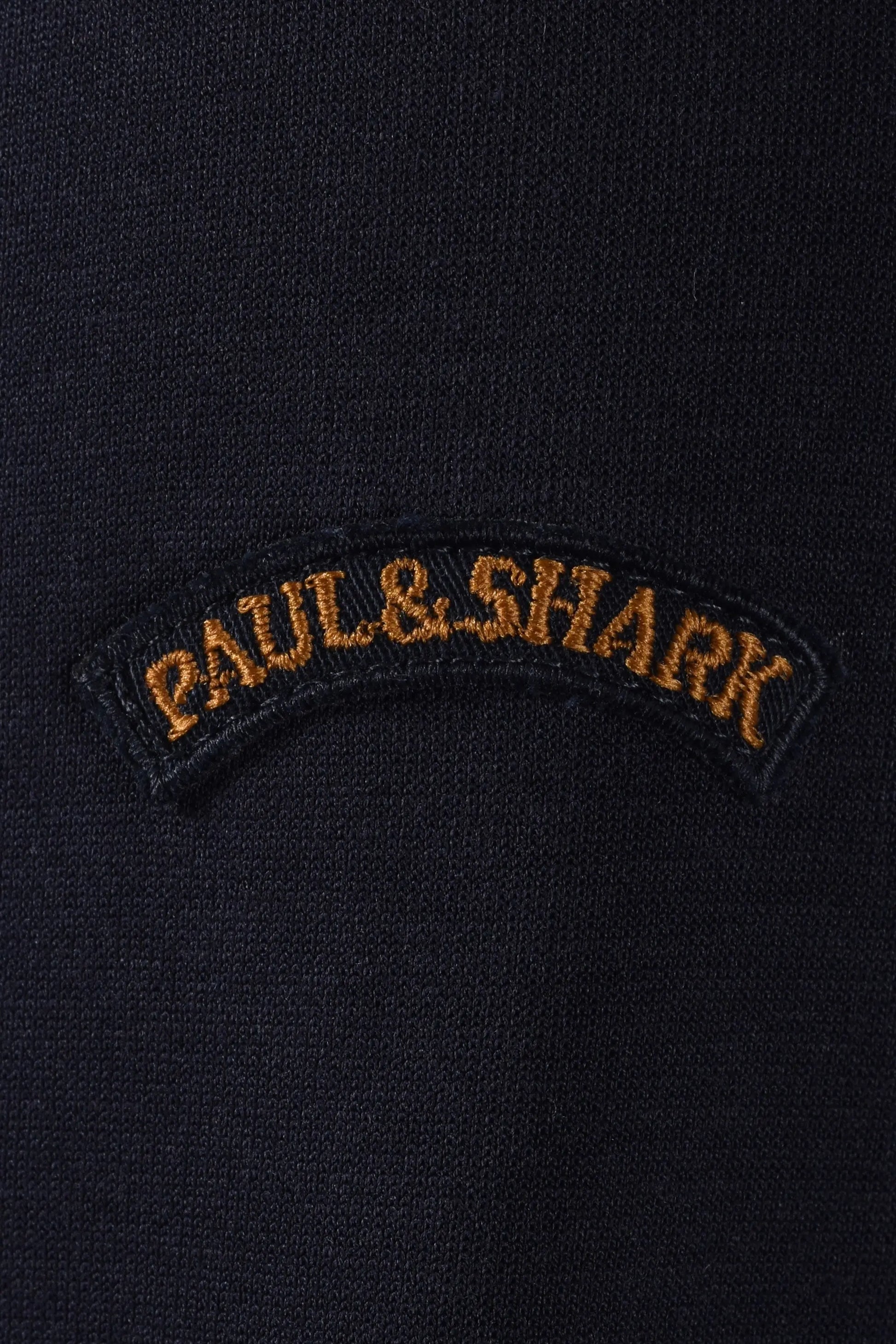 Paul & Shark logo on a dark jacket close up 