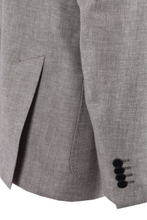 Close up of the sleeves and the flaps on a Roy Robson Linen jacket that has beige hue to it.