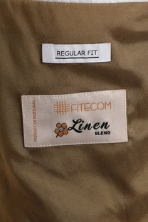 Close up of the labels inside of a Rob Robson jacket in the colour beige.