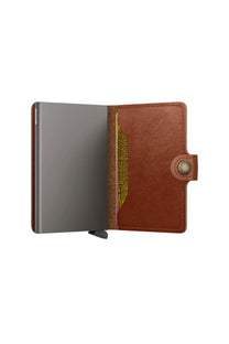 Brown SECRID leather wallet with a card slot on a white background