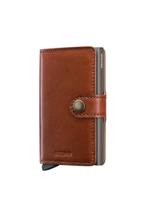 Brown leather SECRID wallet with metal clip on a white background