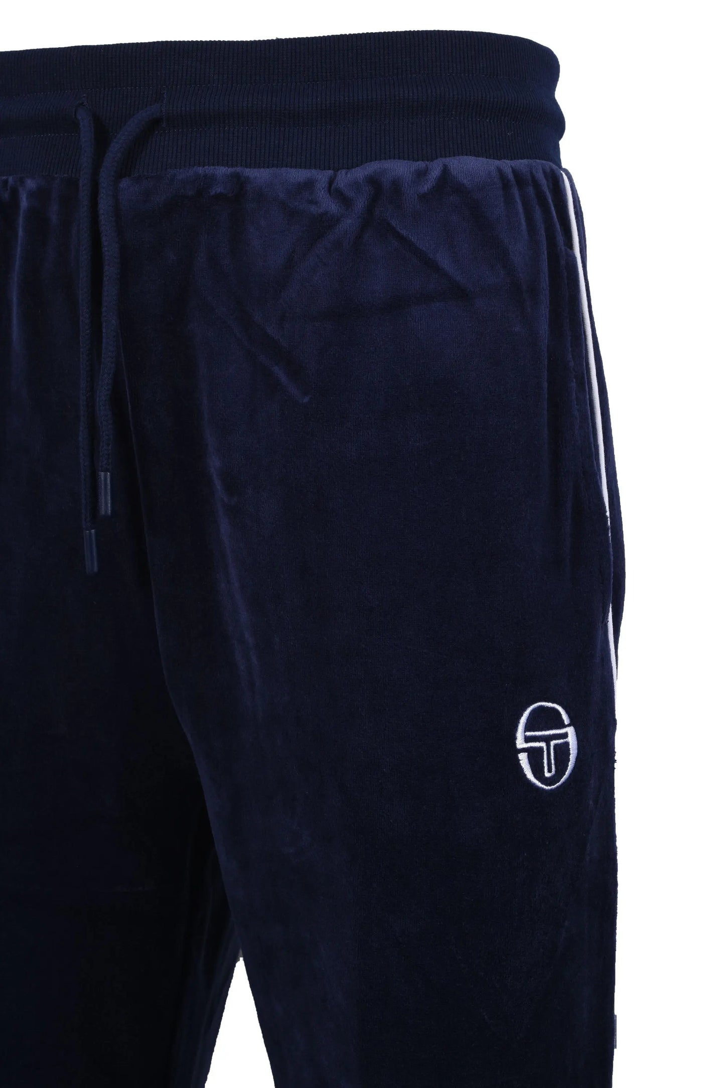 Side picture of a pair of Sergio Tacchini trackpants made from a velour material, featuring white stripe detailing down the side of the trackpant as well as an embroidered Sergio Tacchini logo in white on the front of the garment.