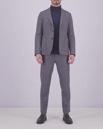 Video of a man wearing a suit or blazer in grey, dressed in a more formal look