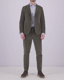 Video of a man wearing a suit or blazer in green, dressed in a more formal look