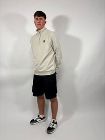 Man wearing a Boss Black t-shirt and BOSS branded shorts 