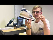 New Balance 574 trainer review, shows the image of the 571 New Balance trainer as the main cover image in a purple colourway